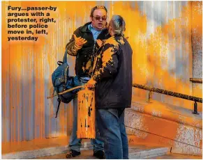  ?? ?? Fury…passer-by argues with a protester, right, before police move in, left, yesterday