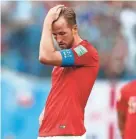  ??  ?? England’s Harry Kane reacts after losing to Belgium in the third-place match of the World Cup on Saturday. NATACHA PISARENKO/AP