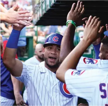  ?? AP ?? Willson Contreras, celebratin­g after scoring in the first inning Thursday, leads NL catchers in All-Star voting.