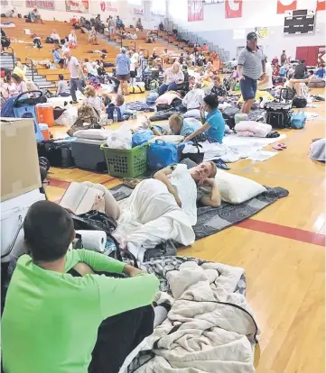  ??  ?? People take shelter at Key West High School in Key West, Florida, as Hurricane Irma approaches. — Reuters photo