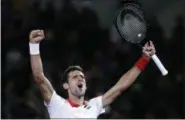  ?? ANDY WONG - THE ASSOCIATED PRESS ?? Novak Djokovic of Serbia celebrates after defeating Borna Coric of Croatia in their men’s singles final match in the Shanghai Masters tennis tournament at Qizhong Forest Sports City Tennis Center in Shanghai, China, Sunday, Oct. 14, 2018.
