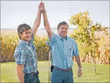  ??  ?? Henry (Dennis Quaid, right) and son Dean (Zac Efron) share a rare moment of camaraderi­e in “At Any Price.”