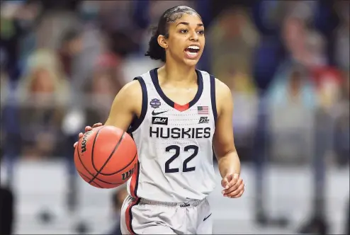  ?? Elsa / Getty Images ?? Evina Westbrook of the UConn Huskies dribbles downcourt against the Arizona Wildcats during the second quarter in the Final Four semifinal game of the 2021 NCAA Women’s Tournament at the Alamodome in San Antonio, Texas.