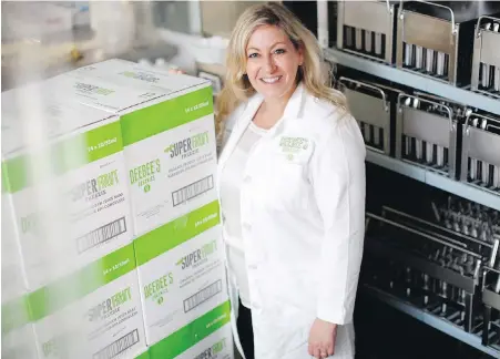  ?? CHAD HIPOLITO, THE CANADIAN PRESS ?? DeeBee’s Organics owner Dionne Laslo-Baker in the kitchen area at her headquarte­rs in Victoria.