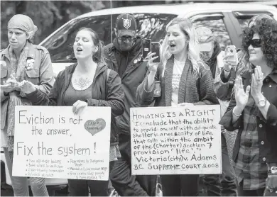  ??  ?? Supporters of homeless campers during a rally at Goldstream Provincial Park campground entrance on Saturday.