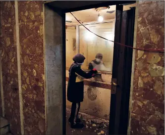  ?? ?? Maha Amin — special needs teacher, volunteer and actor — cleans a room that was once a ticket office on Feb. 16 before she attends a rehearsal at Empire Cinema.