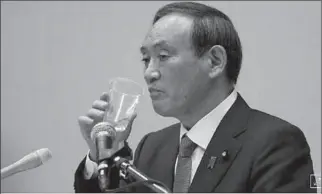  ?? TOKYO
-AFP ?? Yoshihide Suga, Japan's Chief Cabinet Secretary and ruling Liberal Democratic Party (LDP) lawmaker, drinks water during a news conference to announce his candidacy for the party's leadership election, in Tokyo, Japan.
