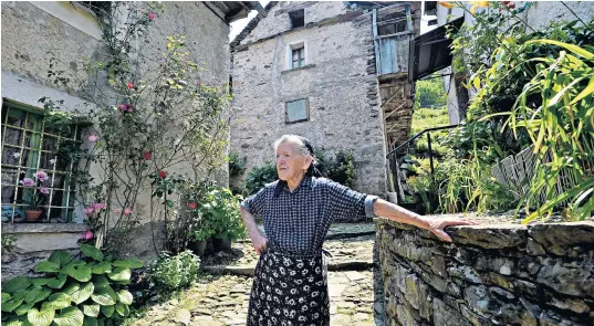  ??  ?? Paolina Grassi, 90, is the sole inhabitant of Casali Socraggio, a once-bustling mountain village on the border with Switzerlan­d