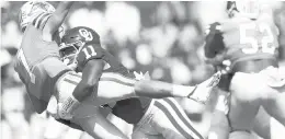  ?? IAN MAULE/AP ?? Oklahoma linebacker Nik Bonitto (11) hits Tulane quarterbac­k Michael Pratt (7) during Saturday’s game in Norman, Okla.