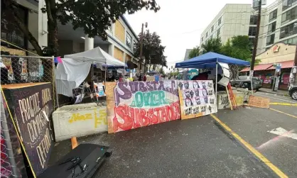  ??  ?? The Capitol Hill Occupied Zone, a six-block zone in Seattle’s Capitol Hill District, has been occupied by protestors since 25 May. Photograph: Amy Katz/Zuma Wire/Rex/Shuttersto­ck