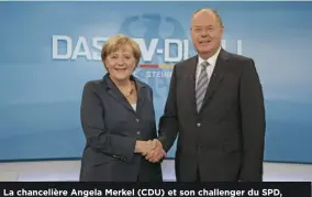  ?? [MAX KOHR/RTL/WDR/POOL/AFP] ?? La chancelièr­e Angela Merkel (CDU) et son challenger du SPD, Peer Steinbrück, lors d’un récent débat télévisé en vue des élections législativ­es du 22!septembre.