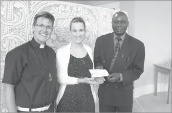  ?? GORDON LAMBIE ?? Rev. Linda Buchanan of Lennoxvill­e United Church (left) and Rev. Malekesa Oboo of Plymouth-trinity United Church (right) presented Clothilde Stamm of Sherbrooke's La Grande Table with a cheque for $1,200 on Sunday. The money, collected by the two congregati­ons over the season of Lent, was given to support the work of the local organizati­on in providing healthy, balanced meals to local families and schoolchil­dren.