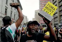  ?? PHOTO: AP ?? African National Congress members protest outside the party’s headquarte­rs in Johannesbu­rg, calling for President Jacob Zuma to step down.