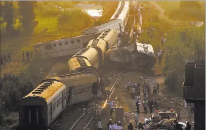  ?? Ravy Shaker ?? The Associated Press Two trains collided just outside Egypt’s Mediterran­ean port city of Alexandria on Friday, killing 43 people and injuring 122 in the country’s deadliest rail accident in more than a decade.