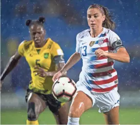  ??  ?? The USA and Alex Morgan (13) defeated Jamaica in a CONCACAF Women’s Championsh­ip semifinal to earn a World Cup berth.