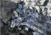  ?? AP ?? The wreckage of a bus lays in a ravine a day after it plunged off a bridge on a mountain pass between Mokopane and Marken, South Africa, on Friday.