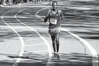  ?? CRAIG RUTTLE/AP ?? Albert Korir runs alone as he closes in on winning the 50th running of the New York City Marathon on Sunday.