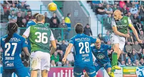  ?? Picture: SNS. ?? Hibernian’s David Gray goes close with a header.