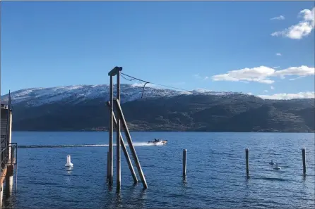  ?? RON SEYMOUR/The Daily Courier ?? A motorboat skims across Okanagan Lake last week. Temperatur­es in Kelowna are on a record-warm pace with the mildest day so far this month not much cooler than some days last June.