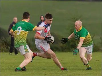  ??  ?? Valleymoun­t’s Dylan Maguire runs into traffic during the JCFC clash with Kilcoole in Ballinakil­l.