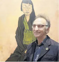  ?? PHOTO: AP ?? Got there this time . . . Artist Tony Costa poses in Sydney, Australia, yesterday, with his portrait of artist Lindy Lee after he won the Archibald Prize.