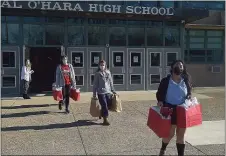  ?? PETE BANNAN - MEDIANEWS GROUP ?? O’Hara students helped pack gifts for Operation Santa Claus Tuesday morning.