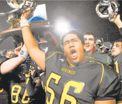  ?? MORNING CALLFILE PHOTO ?? Central Catholic’s Nathan Roberts (56) and teammates celebrate after defeating Bishop McDevitt 28-27 for the PIAA Class 3A state championsh­ip in December 2010 at Hershey.