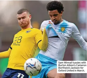  ?? ?? Sam Winnall tussles with Burton Albion’s Cameron Borthwick-Jackson for Oxford United in March.