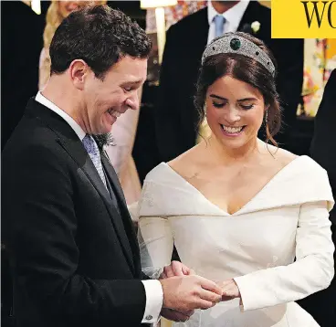  ?? JONATHAN BRADY/AFP/GETTY IMAGES ?? Britain’s Princess Eugenie of York receives the ring from Jack Brooksbank during their star-studded wedding ceremony at Windsor’s St. George’s Chapel Friday, a day that included such celebritie­s as Liv Tyler and Naomi Campbell.