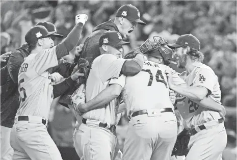  ?? MATT KARTOZIAN, USA TODAY SPORTS ?? The Dodgers celebrate their victory Monday against the Diamondbac­ks that propelled them to the NL Championsh­ip Series.