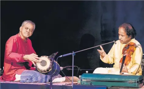  ??  ?? Mahesh Krishnamur­thy (left) plays the mrdangam with composer L Subramania­m on violin at a concert in New York in February 2016 GETTY IMAGES