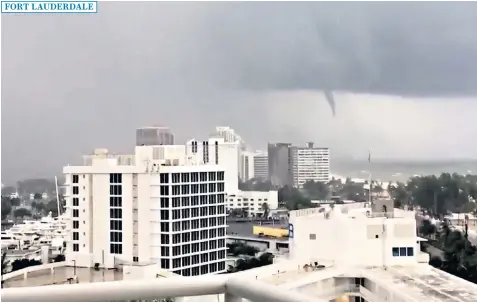  ??  ?? Palm trees lie strewn across the road as Hurricane Irma passes through Miami Beach, right; Cubans wade through a flooded street in Havana, after the hurricane battered central Cuba on Saturday, left; A tornado is seen from Fort Lauderdale beach,...