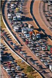  ?? Smiley N. Pool / Houston Chronicle ?? Southbound traffic on I-45 jams both the main lanes and the service road just south of The Woodlands in 2013.