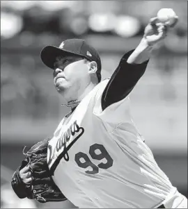  ?? Kent Nishimura Los Angeles Times ?? HYUN-JIN RYU, who led the majors in ERA, will be a free agent and Andrew Friedman said “it’s safe to assume there are conversati­ons” regarding Ryu.