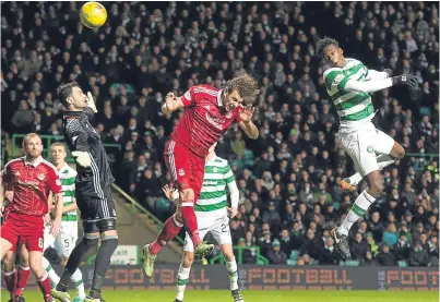  ?? Picture: SNS. ?? Dedryck Boyata’s header flies past Aberdeen keeper Joe Lewis and into the net.