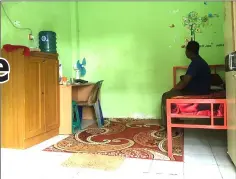  ??  ?? A refugee sits in his bedroom at a migrants accommodat­ion block in Medan, Indonesia Feb 23. — Thomson Reuters Foundation pic