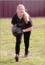  ?? MARK HUMPHREY ENTERPRISE-LEADER ?? Lincoln right fielder Malory Pershall fields a hit up the third base line. The Lady Wolves played stingy defense in beating Huntsville, 3-1, on March 16.