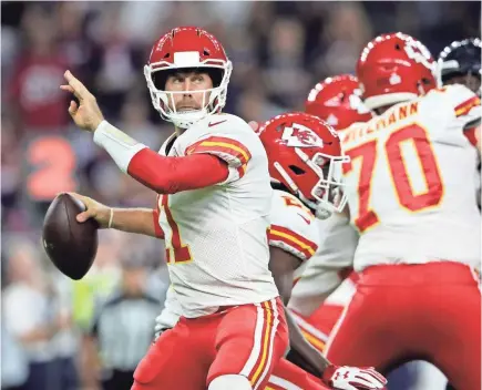  ??  ?? Alex Smith, left, set career highs in passing yards, TD passes and passer rating this season. KEVIN JAIRAJ/USA TODAY SPORTS