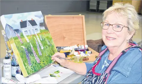  ?? ELIZABETH PATTERSON/CAPE BRETON POST ?? Cecilia McIntosh works on one of her paintings. She is a member of Art Cape Breton. The group will be mounting an exhibit at the New Waterford Credit Union Gallery Main Street Gallery today.