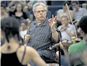  ??  ?? Global star: Itzhak Perlman performs in New York in 2012, above; and, right, conducting for his Perlman Music Program in Tel Aviv in 2014