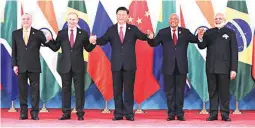  ??  ?? From left: Brazil’s President Michel Temer, Russian President Vladimir Putin, Chinese President Xi Jinping, South Africa’s President Jacob Zuma and Indian Prime Minister Narendra Modi pose for a group photo during the BRICS Summit at the Xiamen...