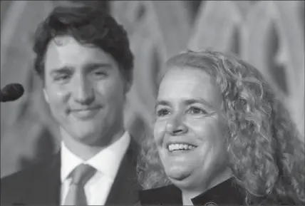  ?? FRED CHARTRAND, THE CANADIAN PRESS ?? Prime Minister Justin Trudeau looks on as former astronaut, and Governor General-designate, Julie Payette,talks to reporters last week.