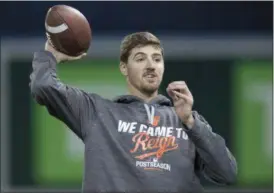  ?? (FRANK GUNN/THE CANADIAN PRESS VIA AP ?? Baltimore Orioles pitcher Kevin Gausman throws a football during a team workout in Toronto on Monday. The Orioles will face the Toronto Blue Jays in Tuesday’s wild-card game.