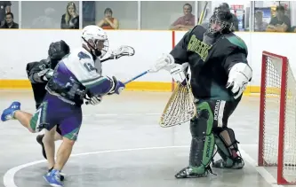  ?? CLIFFORD SKARSTEDT/EXAMINER ?? Peterborou­gh MinCom Kawartha Lakes Realty Jr. C Lakers' Riley Caldwell fires the ball on Gloucester Griffins' goalie Ryan Ogden with pressure from Brandan Irving during first period of Game 2 of OJCLL playoffs of best-of-three series vs on Saturday at...