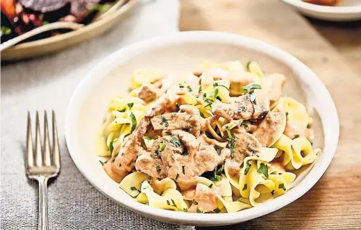  ?? SARAH ANNE WARD FOR THE NEW YORK TIMES. FOOD STYLIST: FRANCES BOSWELL. PROP STYLIST: AMY ELISE WILSON. ?? Beef stroganoff, with sautéed meat in gravy, swamped by buttered noodles, makes for a perfect Sunday dinner.