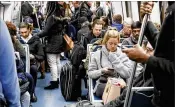  ?? BOB ANDRES / ATLANTA JOURNAL-CONSTITUTI­ON ?? Commuters and travelers fill a MARTA train in Atlanta on Monday that was heading to Hartsfield-Jackson Atlanta Internatio­nal Airport. Many of the passengers said they had been affected by Sunday’s power outage but were hoping to get out Monday. Lack of...