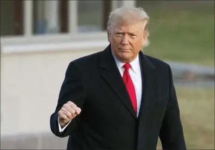  ?? MANUEL BALCE CENETA - THE ASSOCIATED PRESS ?? President Donald Trump gestures as he leaves the White House for a campaign trip to Battle Creek, Mich., Wednesday, Dec. 18, in Washington. Trump is on the cusp of being impeached by the House, with a historic debate set Wednesday on charges that he abused his power and obstructed Congress ahead of votes that will leave a defining mark on his tenure at the White House.