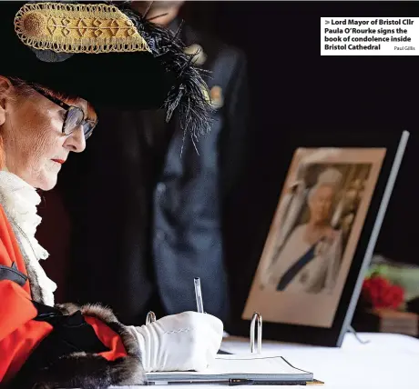  ?? Paul Gillis ?? > Lord Mayor of Bristol Cllr Paula O’Rourke signs the book of condolence inside Bristol Cathedral