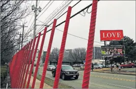  ?? [KYLE ROBERTSON/DISPATCH] ?? The “LOVE” billboard on Cleveland Avenue near Downtown can be seen for some distance, but the message remains the same.