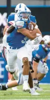  ?? PARKER SEIBOLD/AP ?? Air Force Falcons quarterbac­k Zac Larrier is tackled by Robert Morris’ Kimon O’Sullivan during Saturday’s game at Air Force Academy, Colorado.